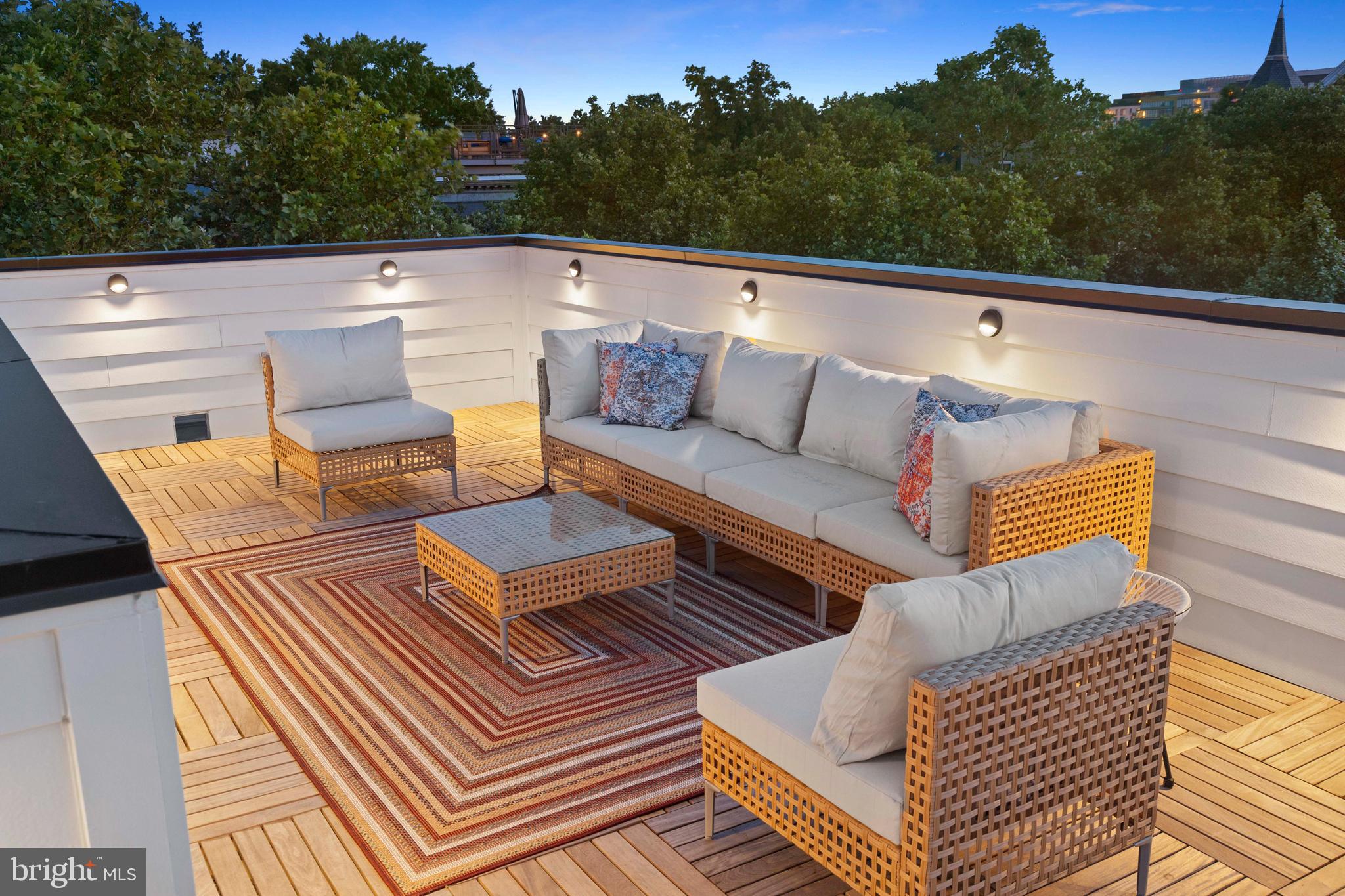 441 Q Street Northwest, Unit PH Washington, DC 20001 - Photo 45 of 55 a terrace of a house with wooden floor and outdoor seating