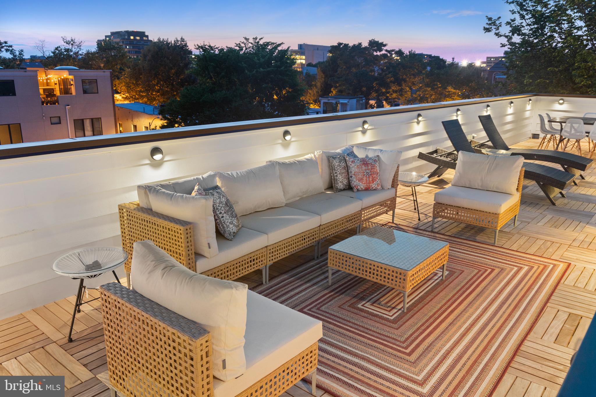 441 Q Street Northwest, Unit PH Washington, DC 20001 - Photo 47 of 55 a view of a roof deck with couches and sky view