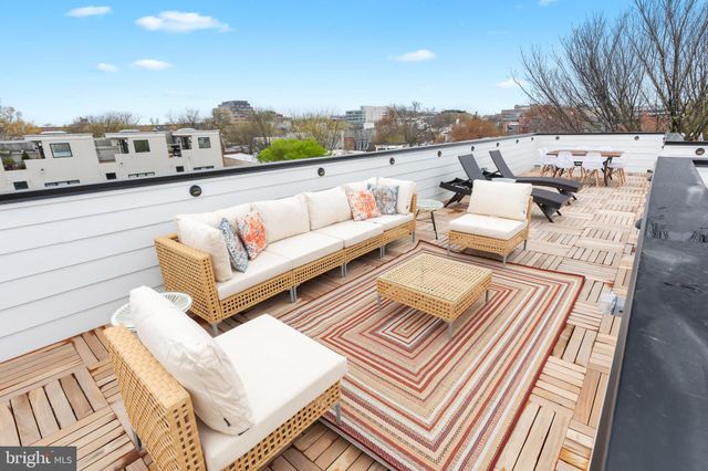 a view of house with yard and flat screen tv