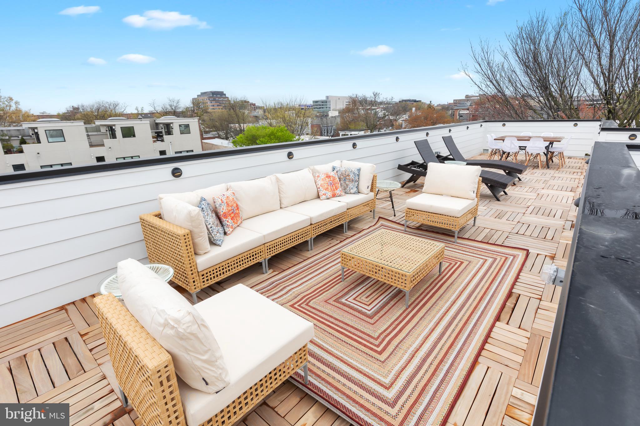 441 Q Street Northwest, Unit PH Washington, DC 20001 - Photo 48 of 55 a view of a terrace with couches and sky view