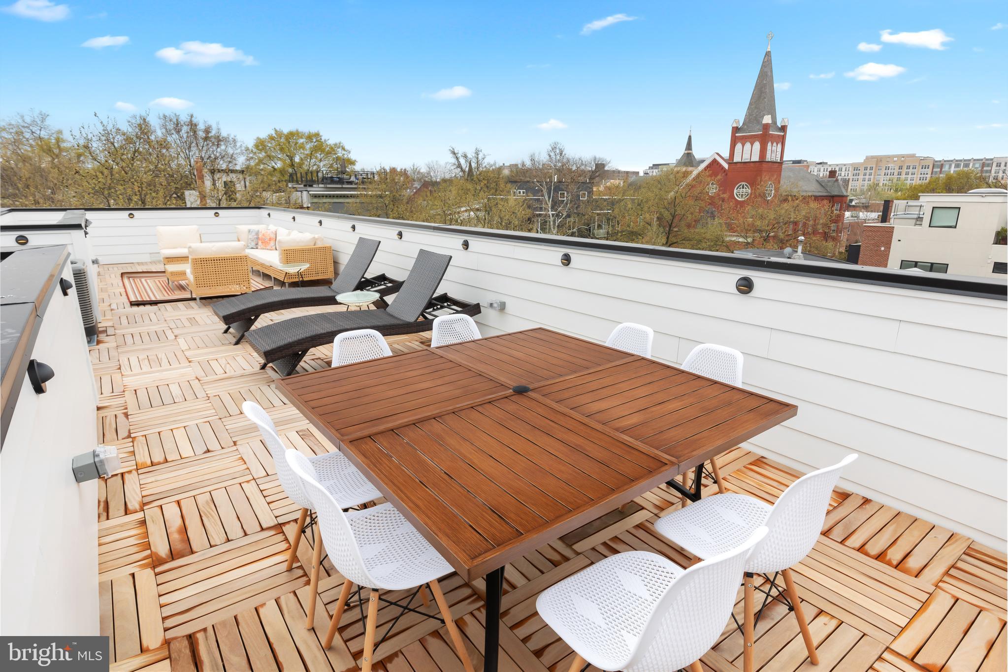 441 Q Street Northwest, Unit PH Washington, DC 20001 - Photo 49 of 55 a view of a terrace with furniture and a garden