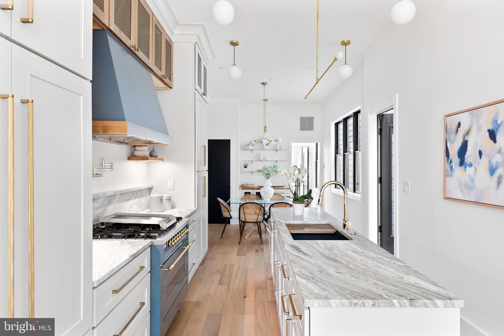 441 Q Street Northwest, Unit PH Washington, DC 20001 - Photo 9 of 55 a very nice looking living room with stainless steel appliances furniture a rug and a kitchen view