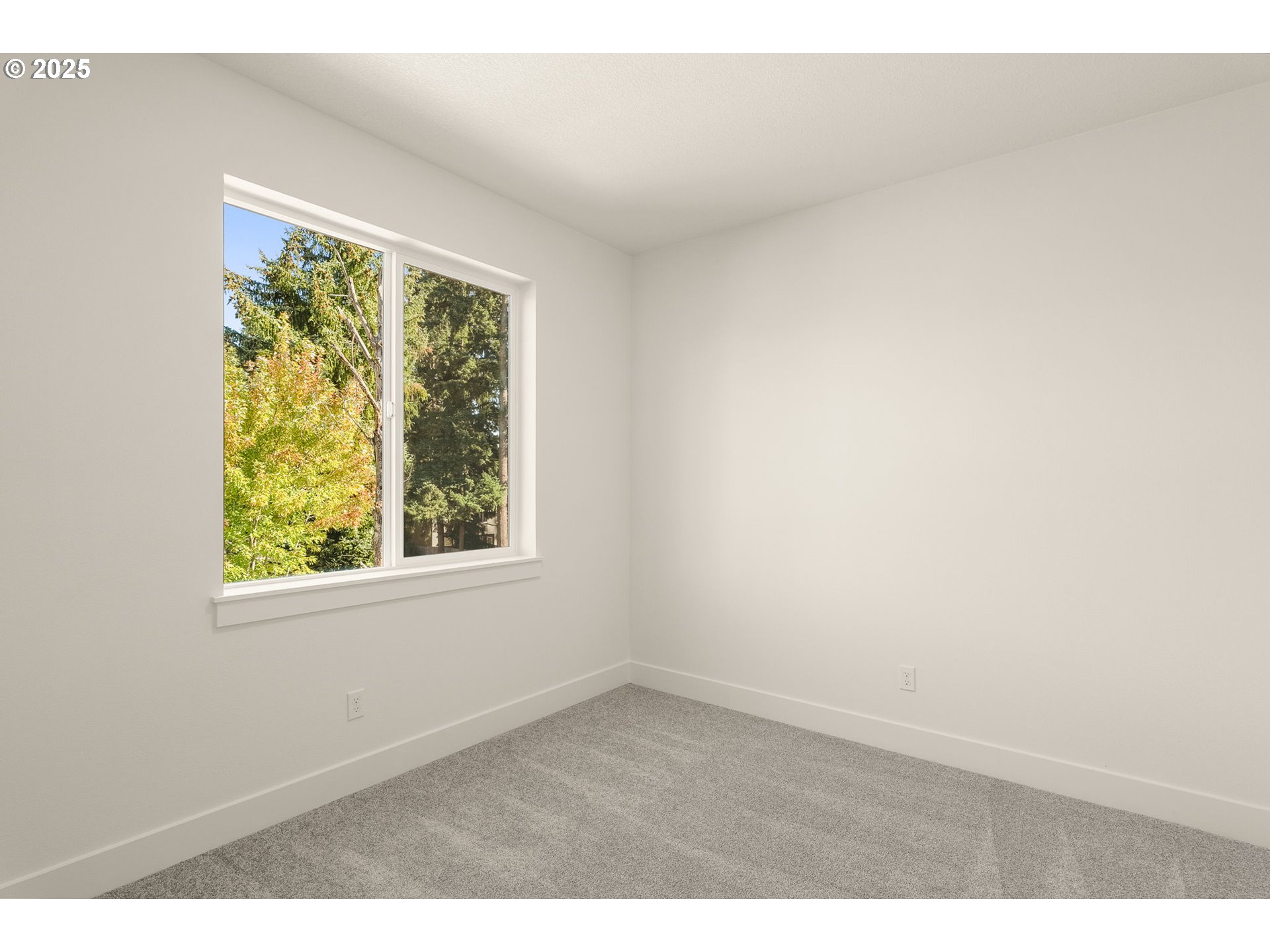 18933 Southwest Hazelwood Lane, Unit L9 Beaverton, OR 97078 - Photo 18 of 29 an empty room with a window