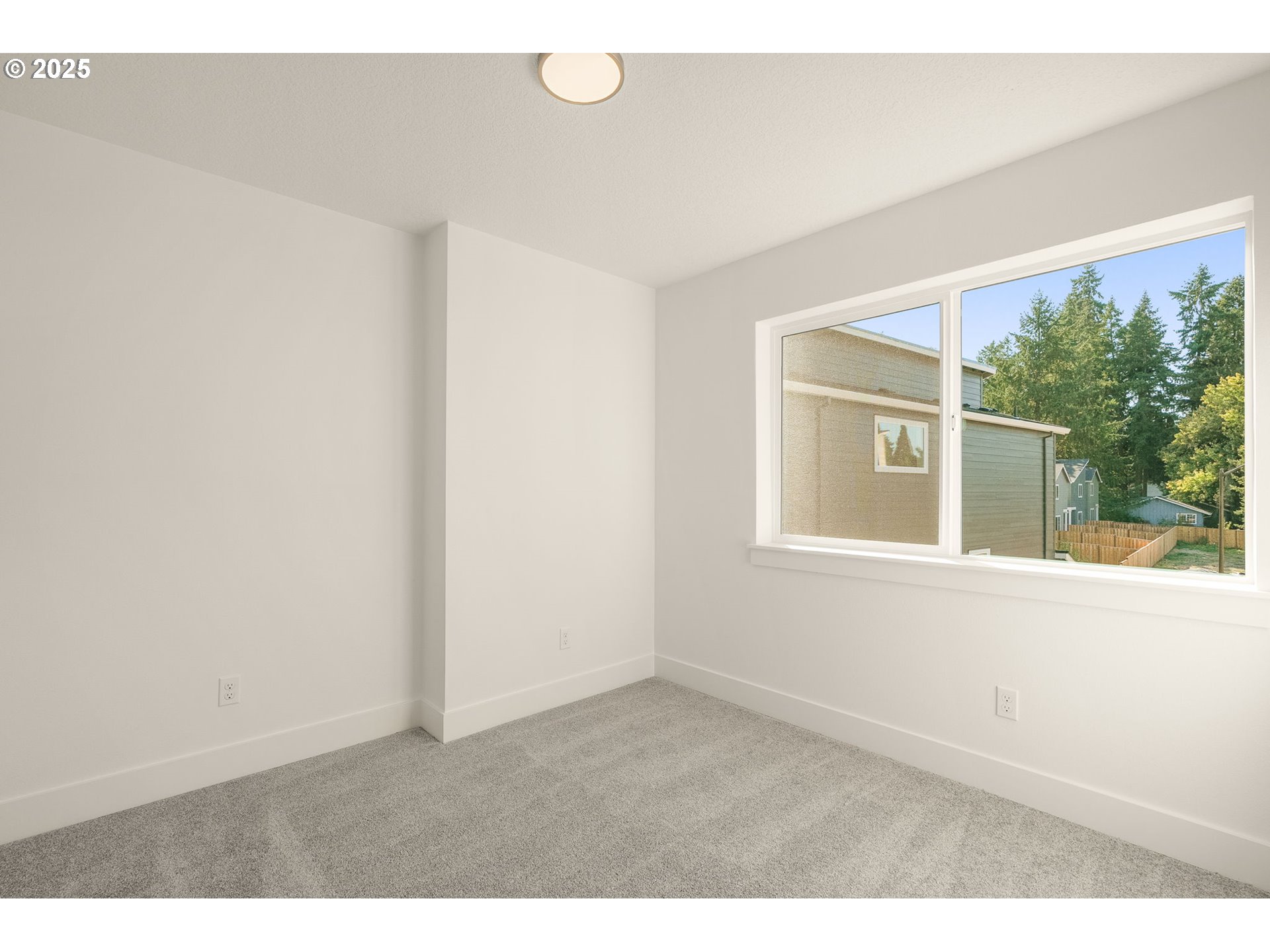 18933 Southwest Hazelwood Lane, Unit L9 Beaverton, OR 97078 - Photo 19 of 29 view of an empty room with a window