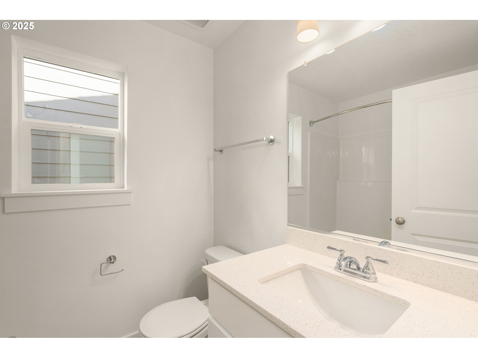 18933 Southwest Hazelwood Lane, Unit L9 Beaverton, OR 97078 - Photo 20 of 29 a bathroom with a sink vanity granite and a mirror