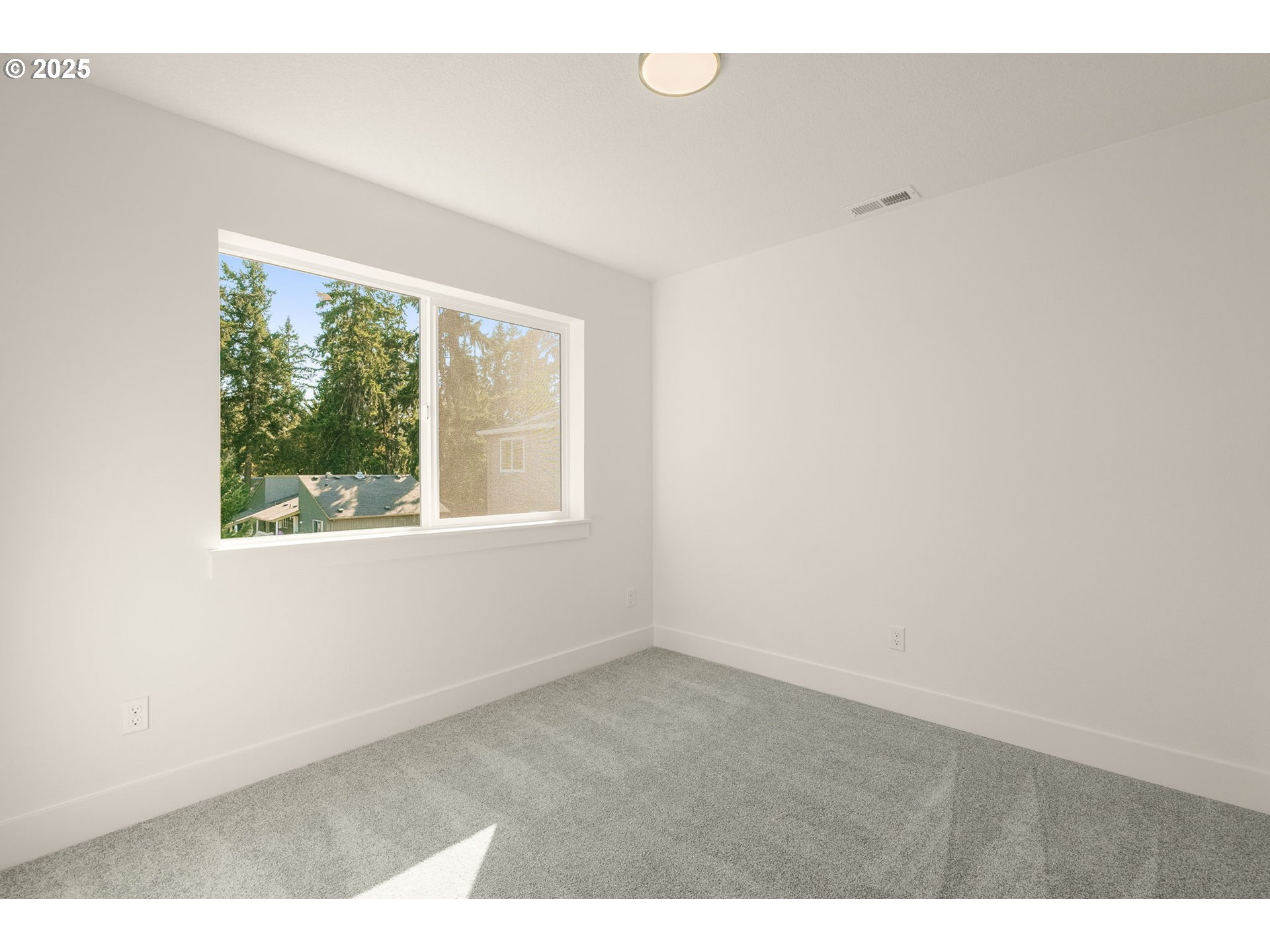 18933 Southwest Hazelwood Lane, Unit L9 Beaverton, OR 97078 - Photo 21 of 29 an empty room with a window