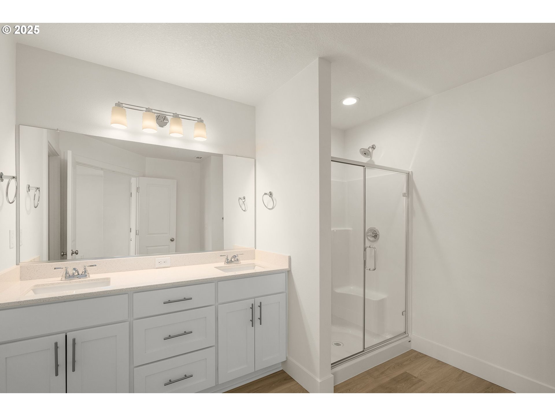 18933 Southwest Hazelwood Lane, Unit L9 Beaverton, OR 97078 - Photo 25 of 29 a bathroom with a shower sink and mirror