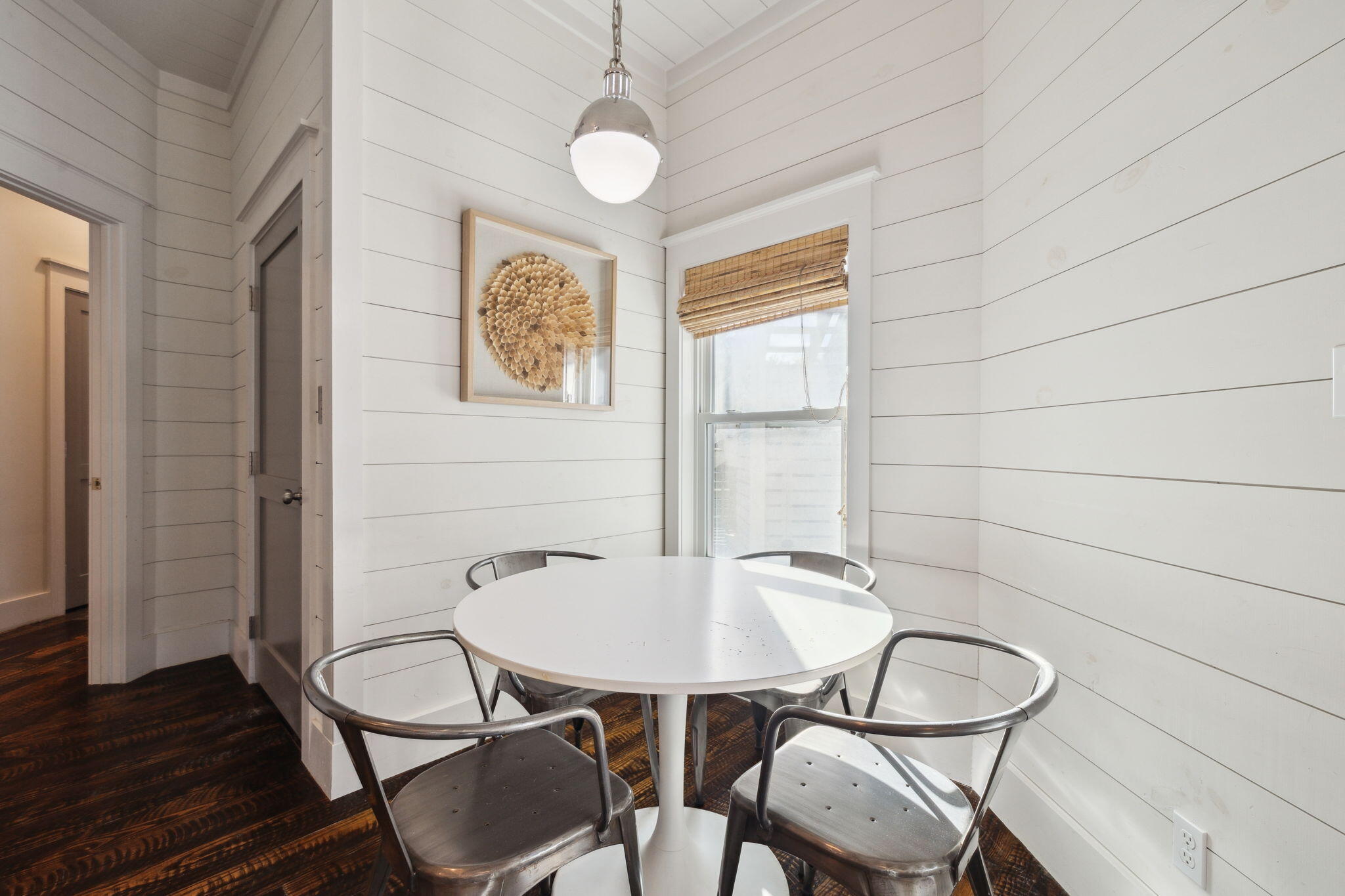 59 Montigo Avenue Santa Rosa Beach, FL 32459 - Photo 12 of 48 a view of a dining room with furniture and wooden floor