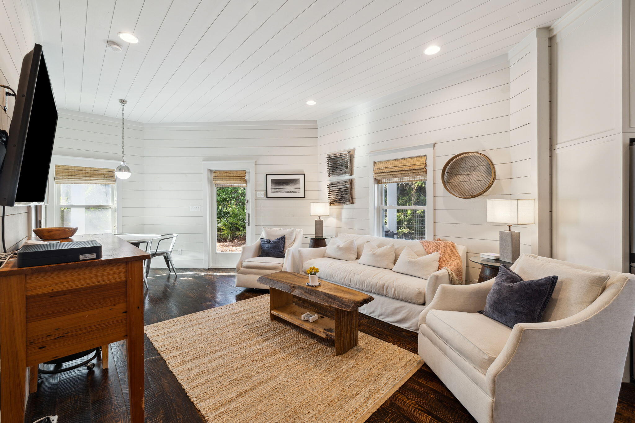 59 Montigo Avenue Santa Rosa Beach, FL 32459 - Photo 16 of 48 a living room with furniture a flat screen tv and a large window