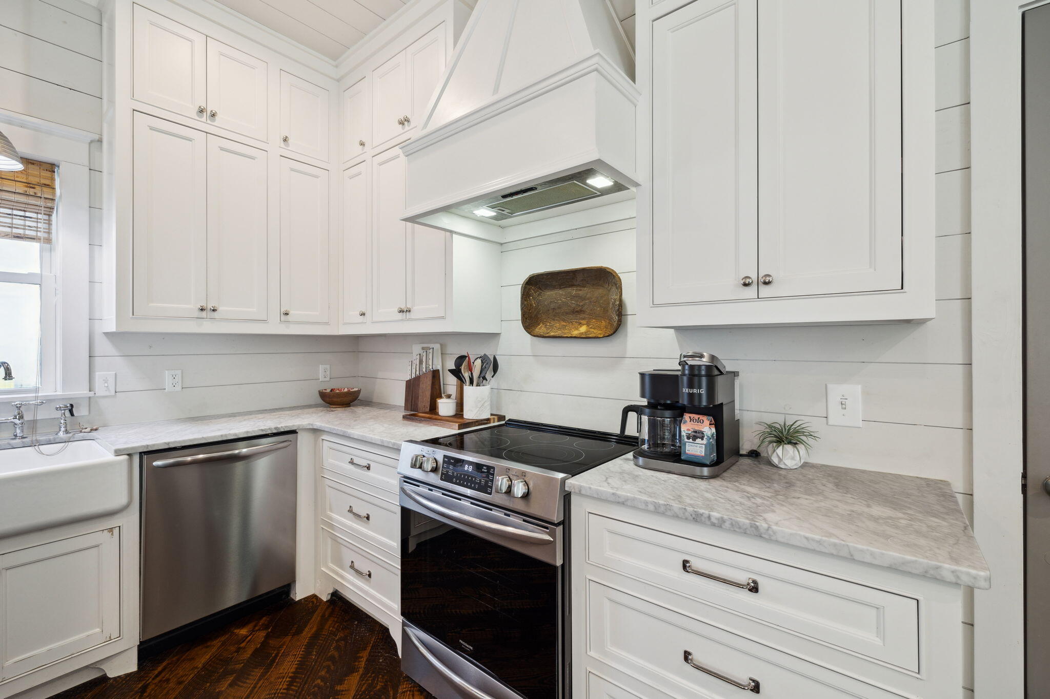 59 Montigo Avenue Santa Rosa Beach, FL 32459 - Photo 17 of 48 a kitchen with granite countertop white cabinets stainless steel appliances and sink