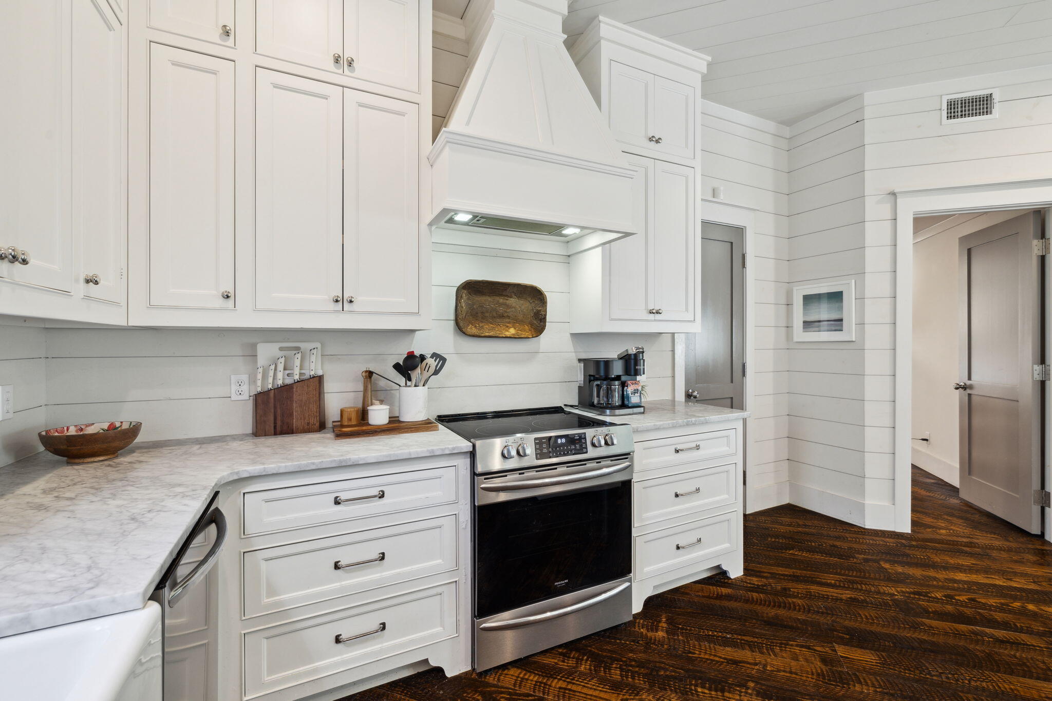 59 Montigo Avenue Santa Rosa Beach, FL 32459 - Photo 19 of 48 a kitchen with stainless steel appliances granite countertop a stove and a wooden cabinets