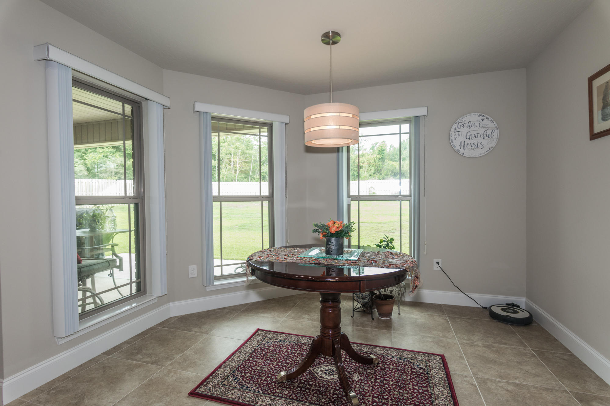 4675 Chanteuse Parkway Crestview, FL 32539 - Photo 15 of 35 a living room with furniture and a window