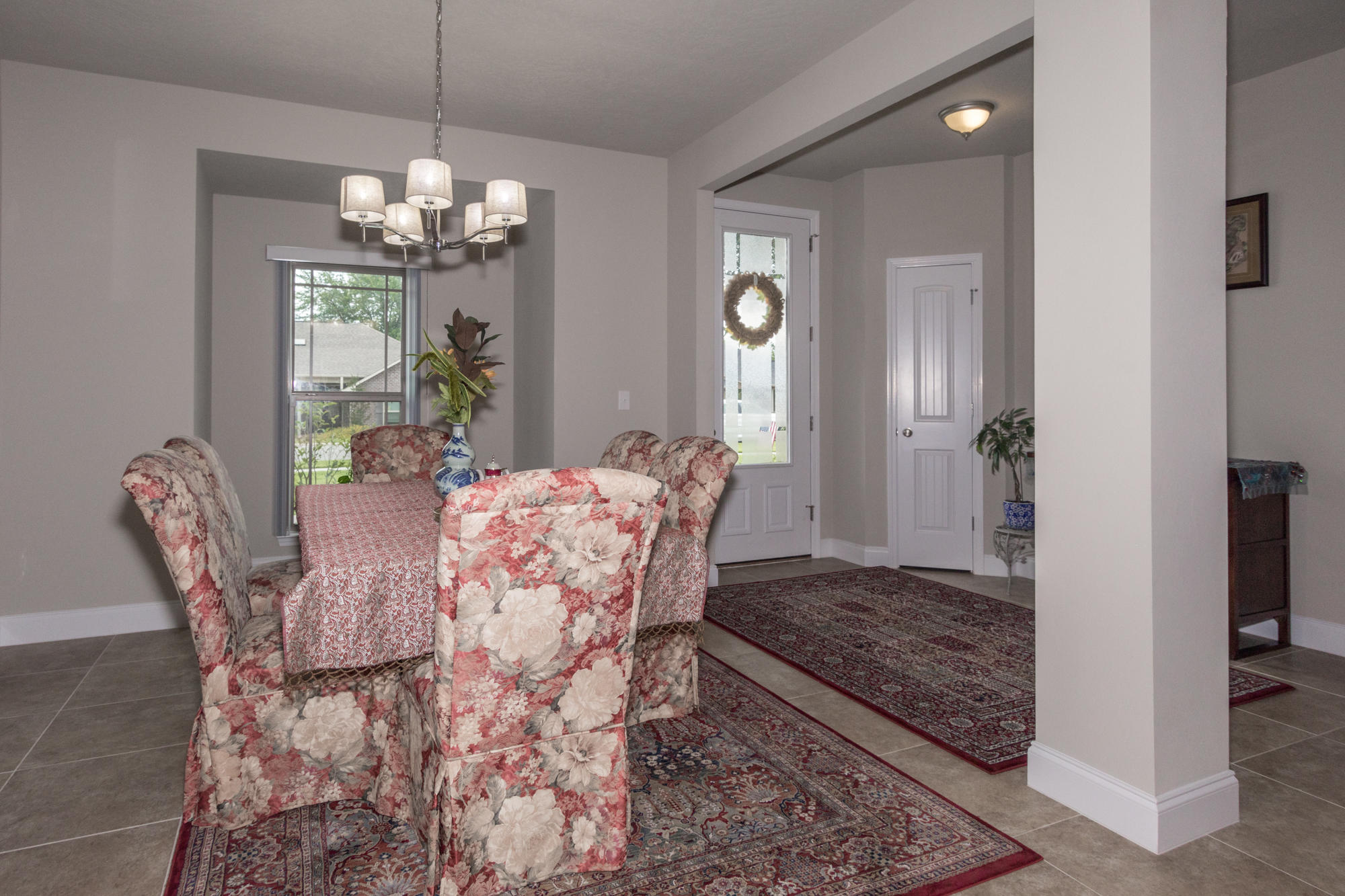 4675 Chanteuse Parkway Crestview, FL 32539 - Photo 16 of 35 a view of a dining room with furniture and chandelier