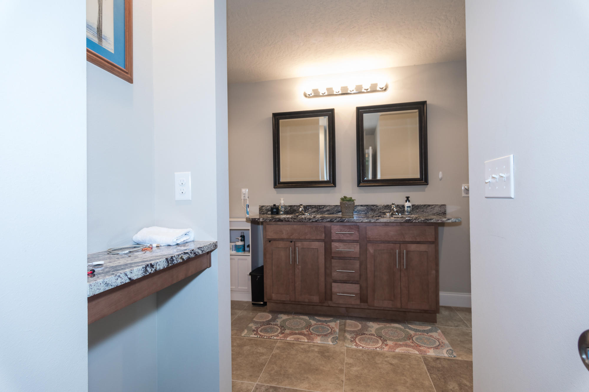 4675 Chanteuse Parkway Crestview, FL 32539 - Photo 20 of 35 a bathroom with a granite countertop sink and a mirror