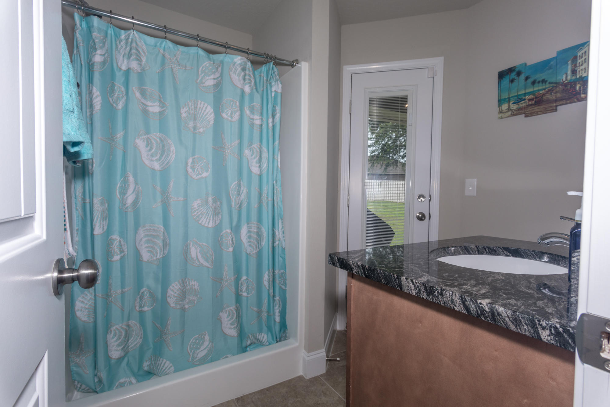 4675 Chanteuse Parkway Crestview, FL 32539 - Photo 25 of 35 a bathroom with a granite countertop sink and a mirror