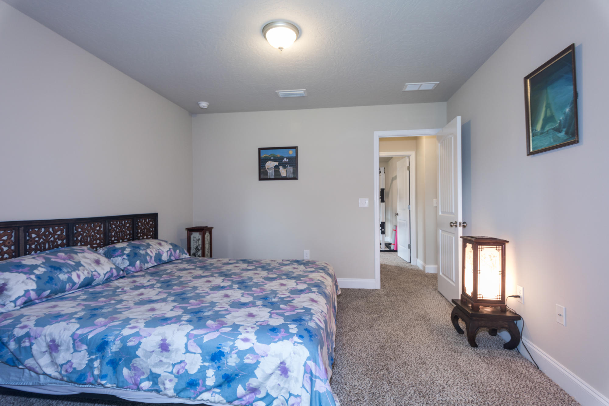 4675 Chanteuse Parkway Crestview, FL 32539 - Photo 27 of 35 a bedroom with a large bed and a window