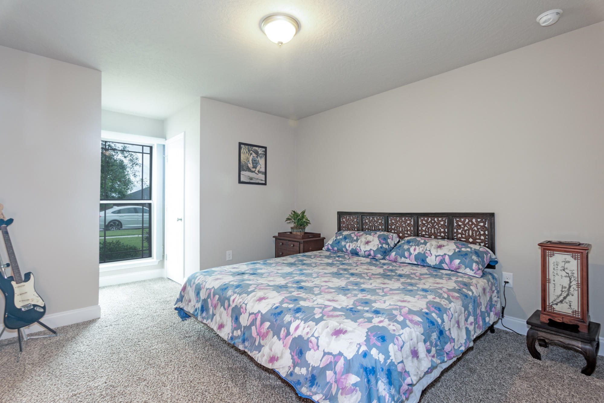 4675 Chanteuse Parkway Crestview, FL 32539 - Photo 28 of 35 a bedroom with a bed and a window