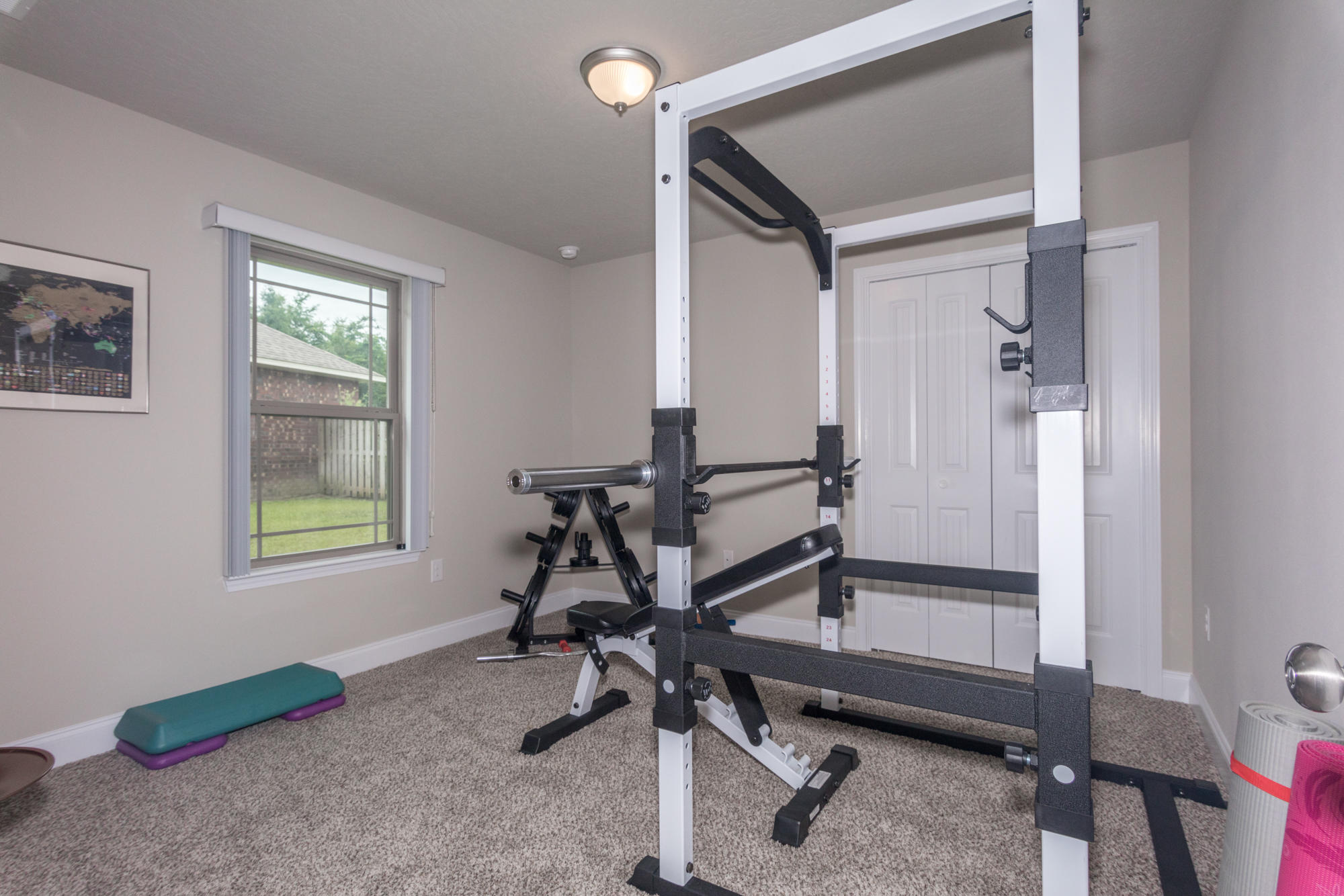 4675 Chanteuse Parkway Crestview, FL 32539 - Photo 30 of 35 a view of a room with gym equipment