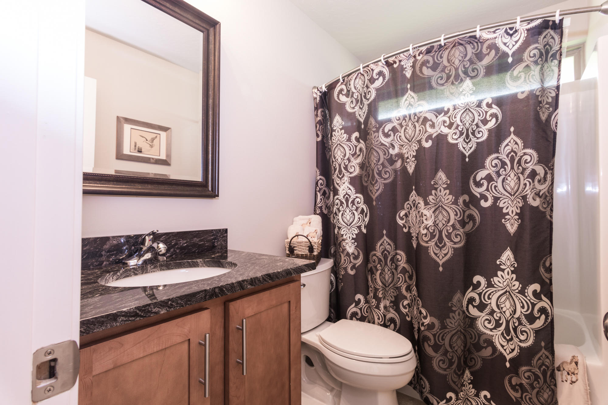 4675 Chanteuse Parkway Crestview, FL 32539 - Photo 31 of 35 a bathroom with a toilet sink and mirror