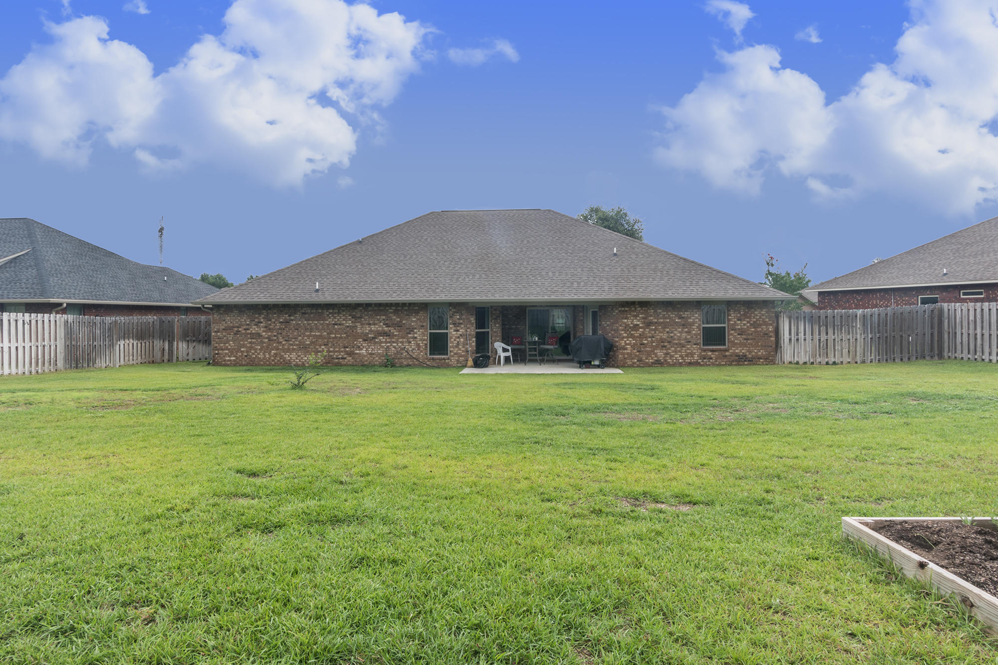 4675 Chanteuse Parkway Crestview, FL 32539 - Photo 6 of 35 a front view of a house with a garden