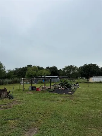 a view of a lake with houses in background