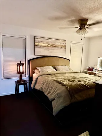 a bedroom with a bed and a table