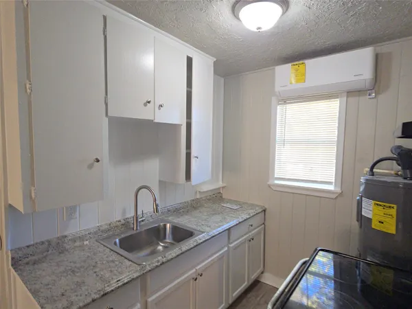 a kitchen with sink and window