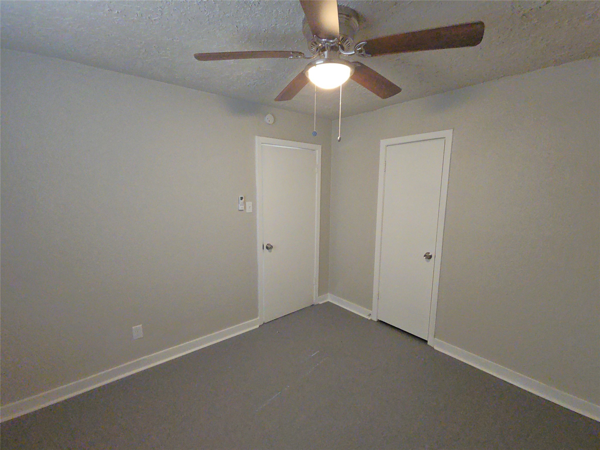 3335 Tuam Street, Unit 3 Houston, TX 77004 - Photo 7 of 16 an empty room with a fan & a ceiling fan