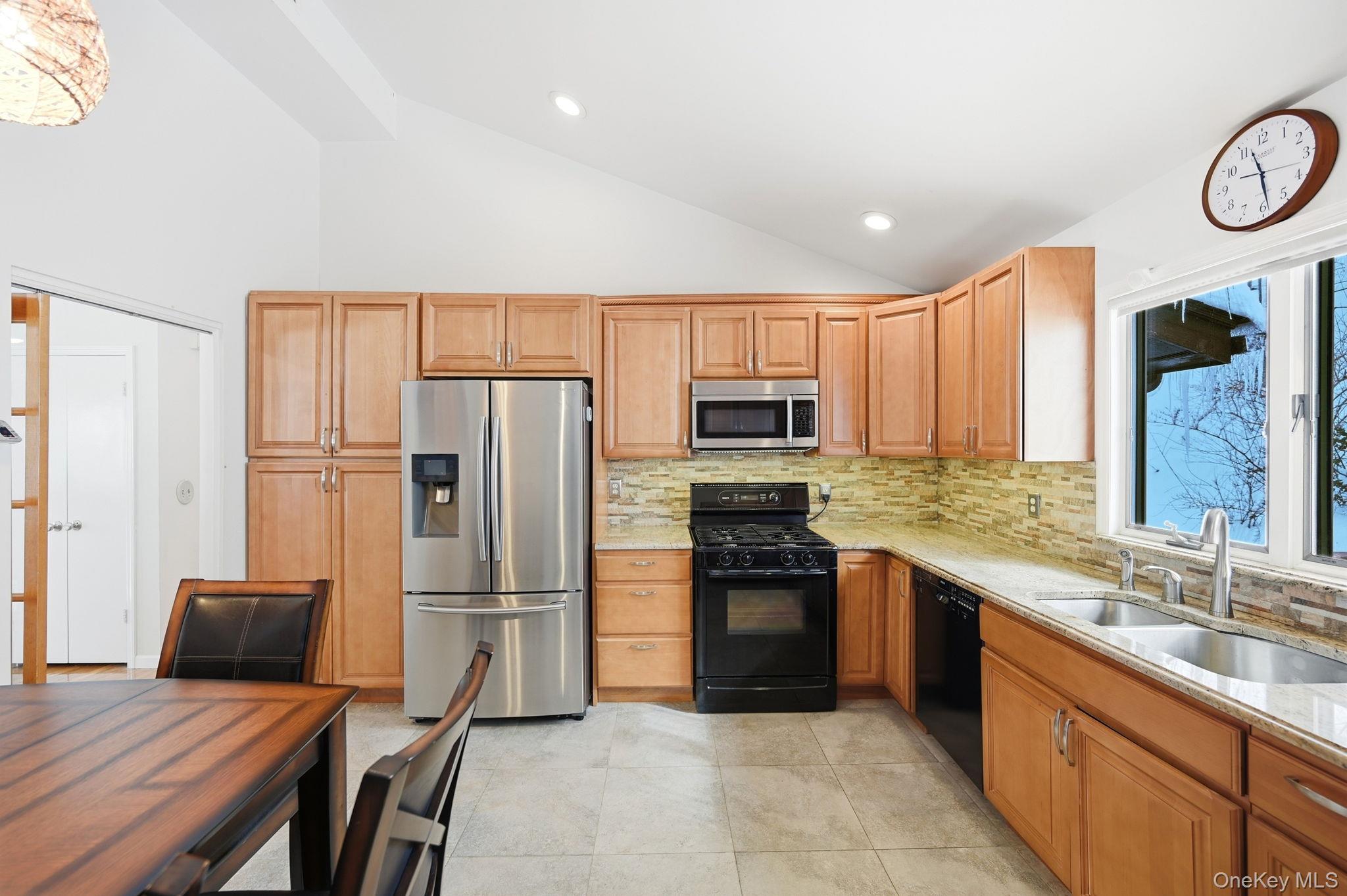 10 Pine Brook Road Ossining, NY 10562 - Photo 12 of 48 a kitchen with stainless steel appliances granite countertop a refrigerator stove top oven and sink