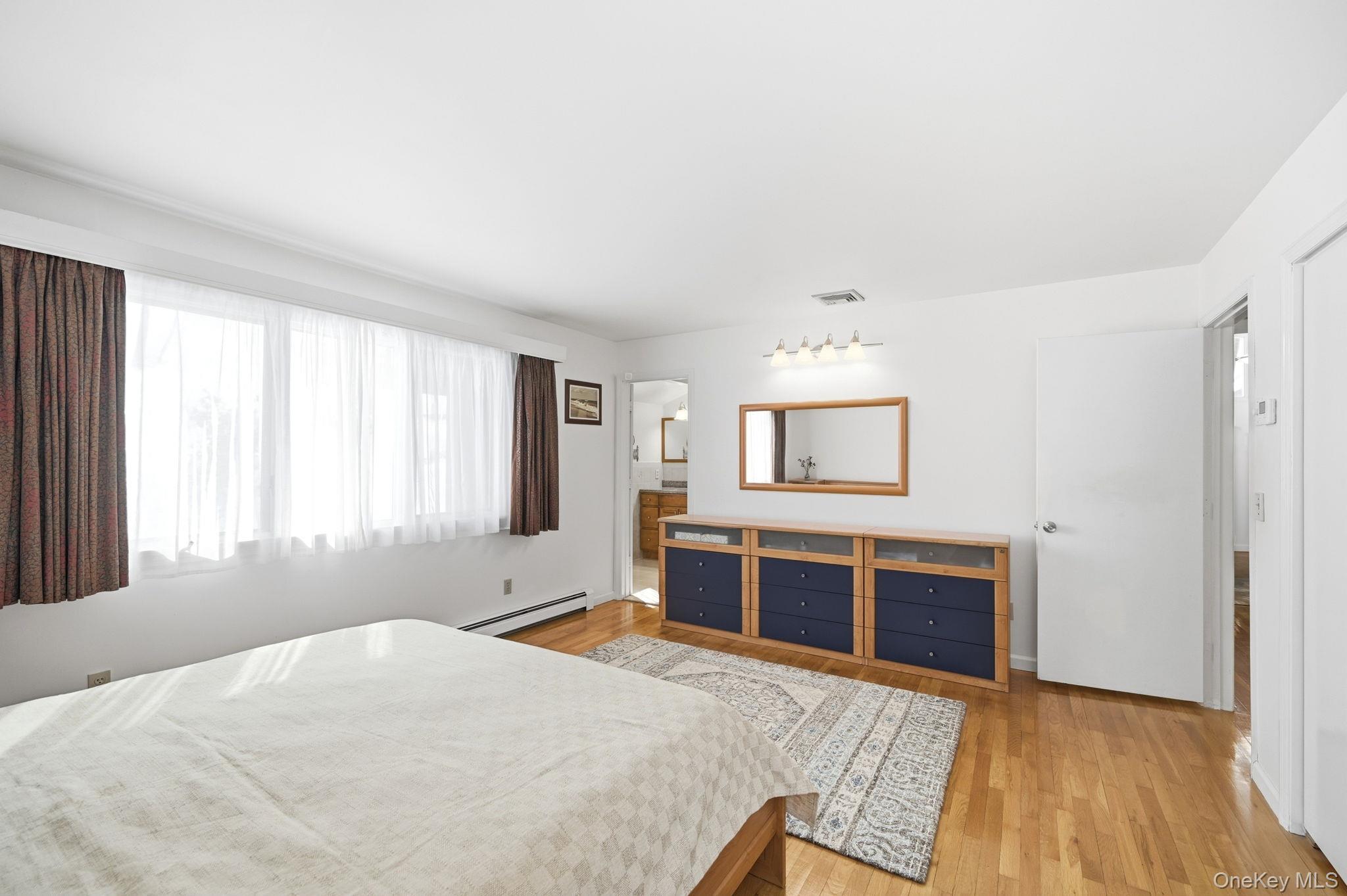 10 Pine Brook Road Ossining, NY 10562 - Photo 19 of 48 a bedroom with a bed and a dresser