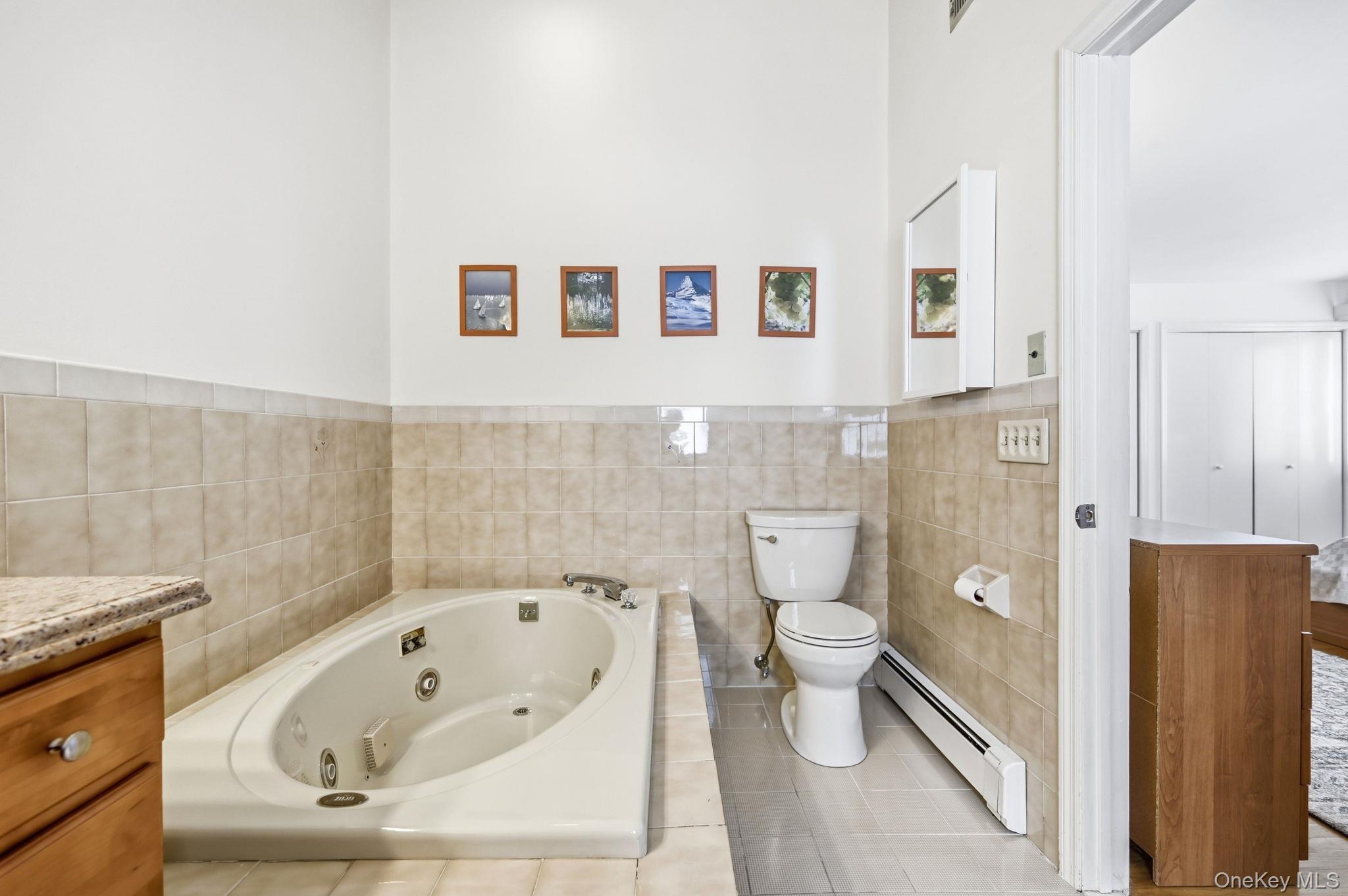 10 Pine Brook Road Ossining, NY 10562 - Photo 22 of 48 a bathroom with a toilet and a bathtub