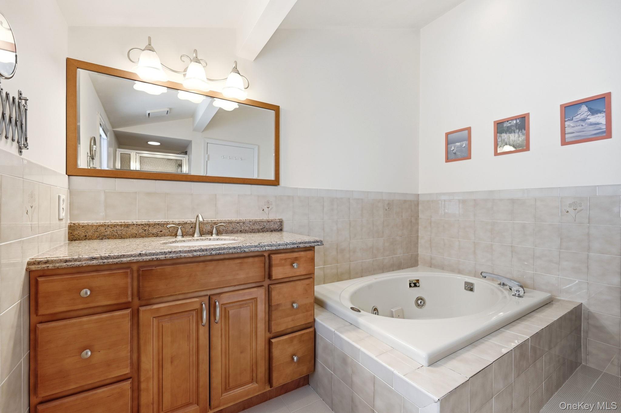 10 Pine Brook Road Ossining, NY 10562 - Photo 23 of 48 a bathroom with a sink vanity and mirror
