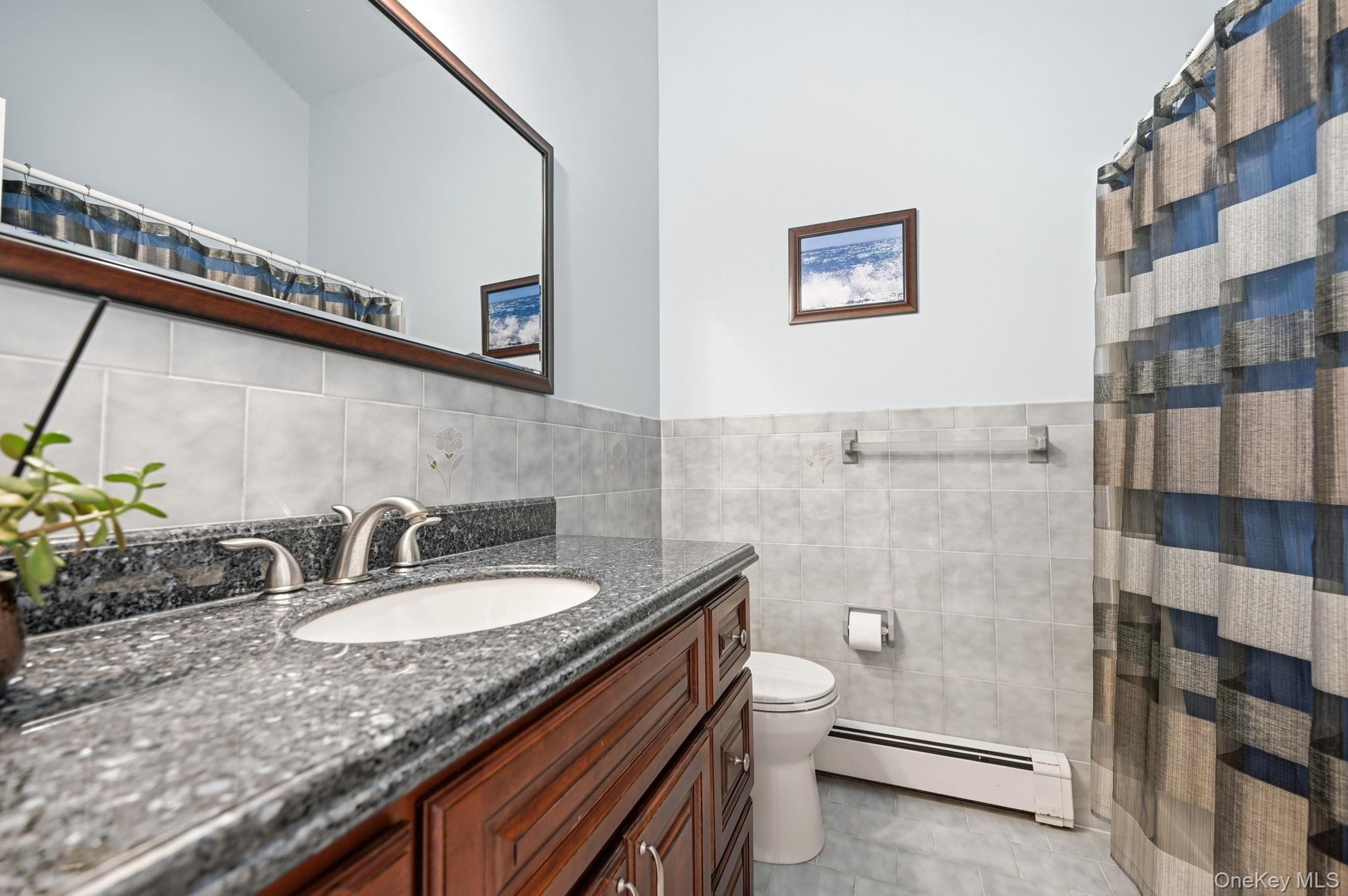 10 Pine Brook Road Ossining, NY 10562 - Photo 25 of 48 a bathroom with a granite countertop sink a toilet and shower