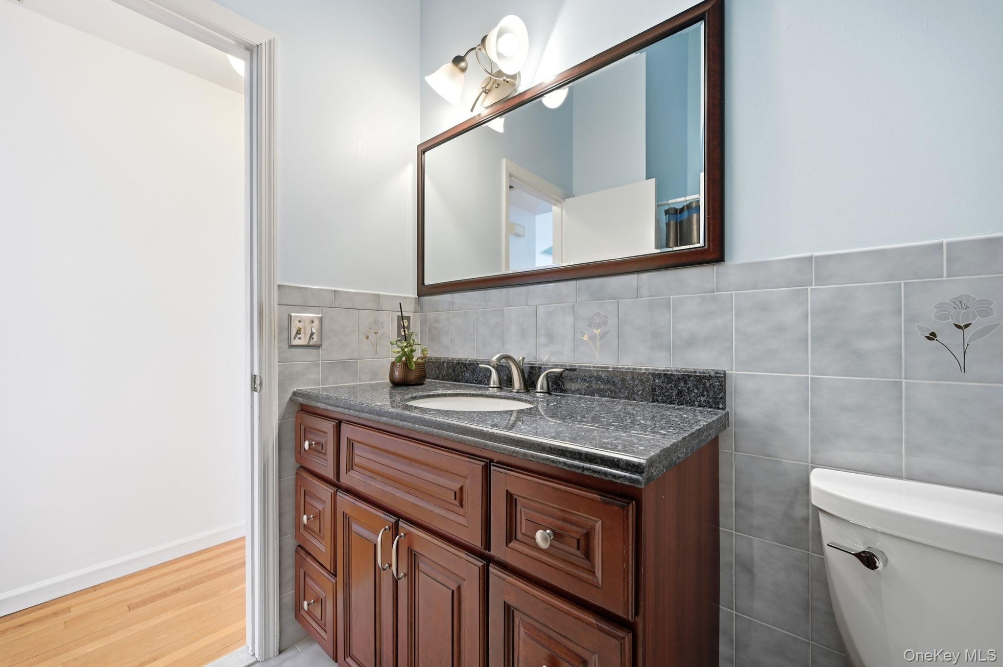 10 Pine Brook Road Ossining, NY 10562 - Photo 26 of 48 a bathroom with a sink a vanity and a mirror