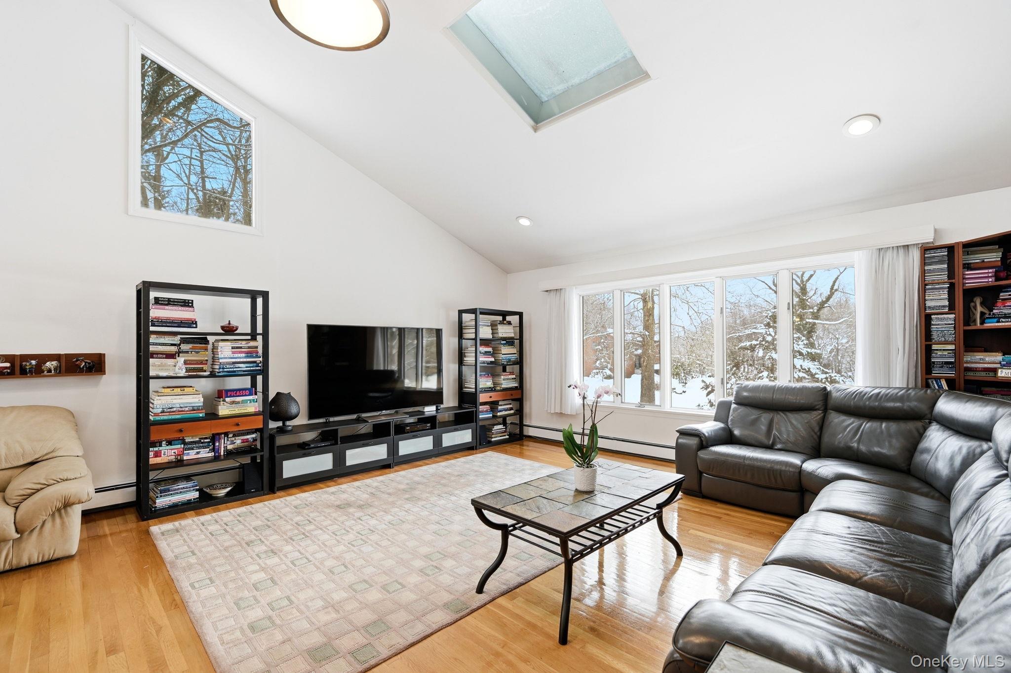 10 Pine Brook Road Ossining, NY 10562 - Photo 3 of 48 a living room with furniture and a flat screen tv