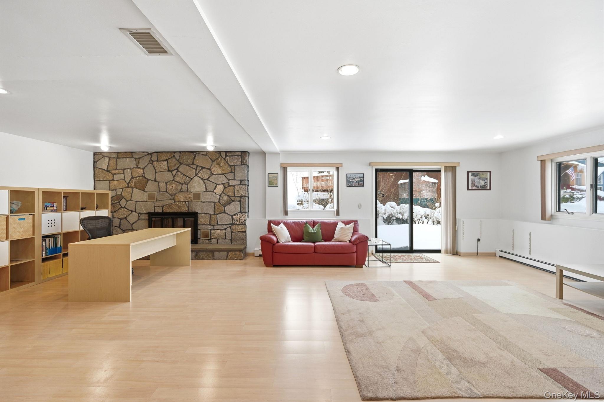 10 Pine Brook Road Ossining, NY 10562 - Photo 32 of 48 a living room with furniture and a fireplace