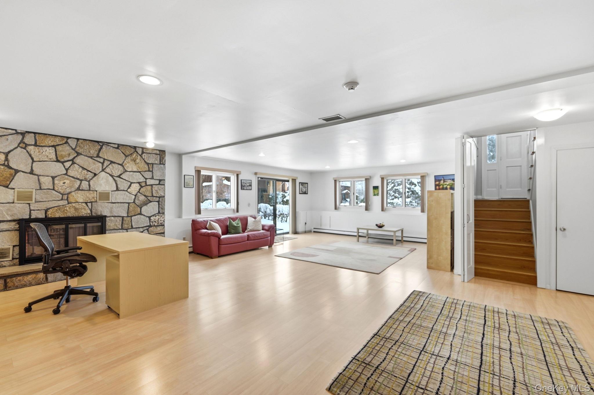 10 Pine Brook Road Ossining, NY 10562 - Photo 33 of 48 a living room with furniture and a fireplace