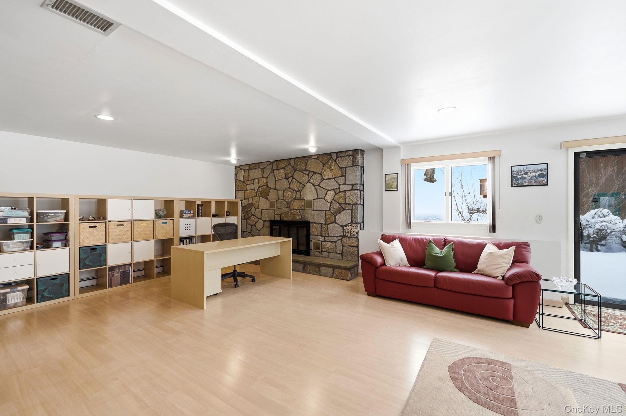 10 Pine Brook Road Ossining, NY 10562 - Photo 38 of 48 a living room with furniture and a fireplace