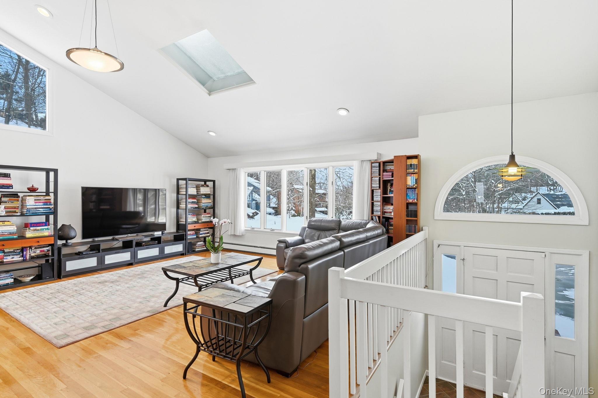 10 Pine Brook Road Ossining, NY 10562 - Photo 4 of 48 a living room with furniture and a flat screen tv