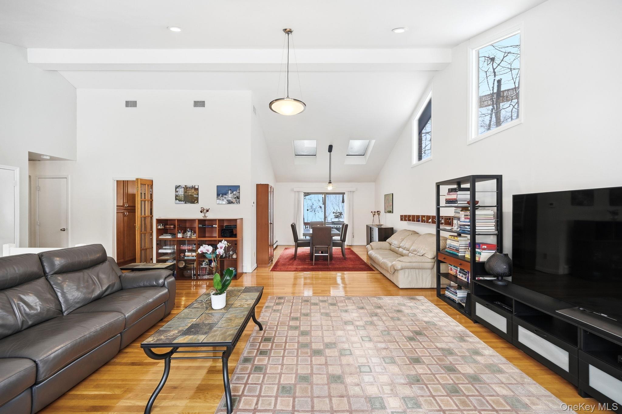 10 Pine Brook Road Ossining, NY 10562 - Photo 9 of 48 a living room with furniture and a flat screen tv