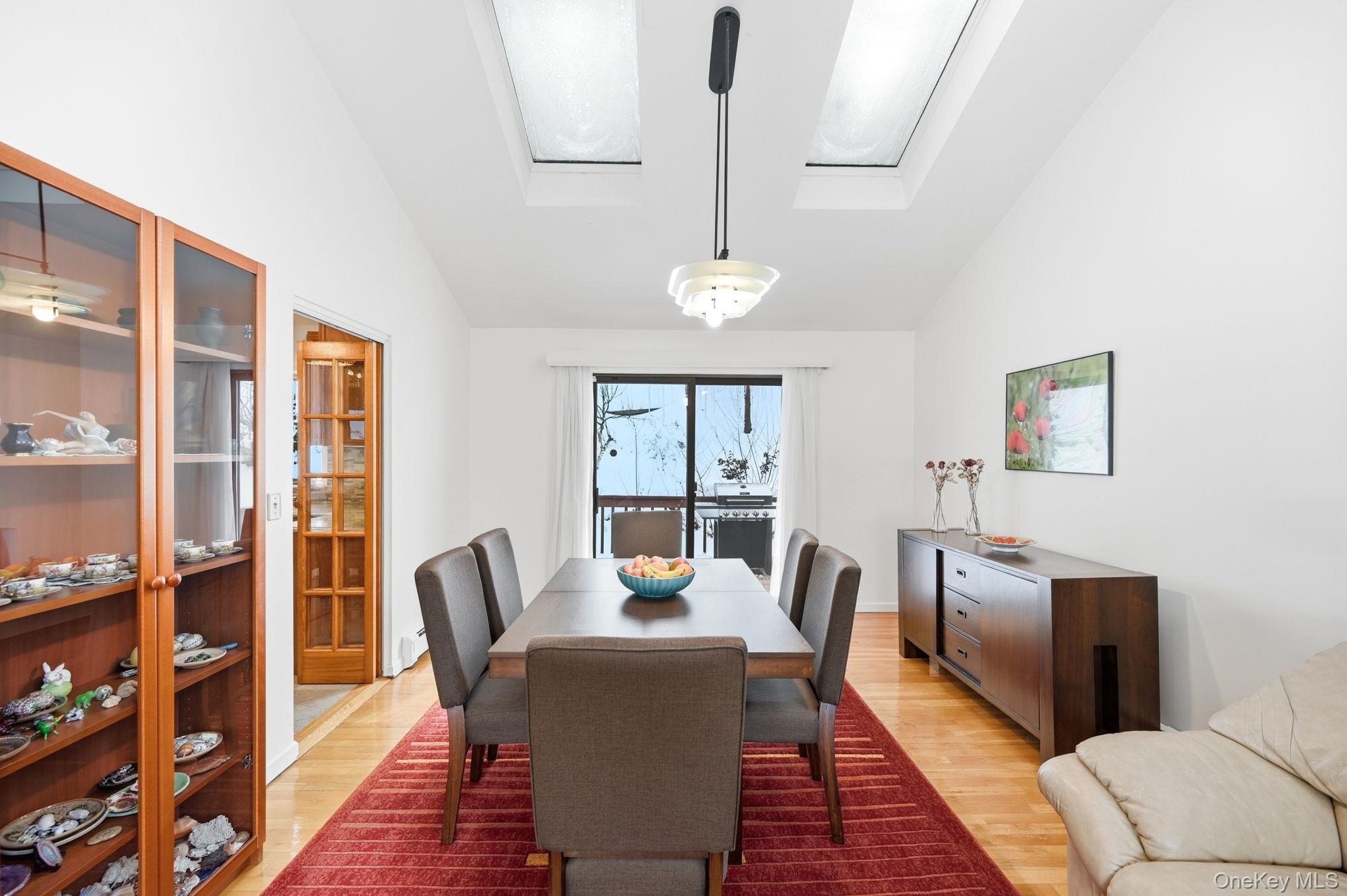 10 Pine Brook Road Ossining, NY 10562 - Photo 10 of 48 a dining room with furniture a rug and wooden floor