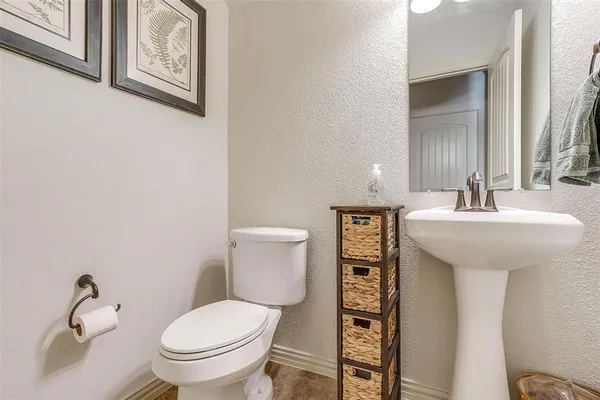 a kitchen with granite countertop stainless steel appliances a refrigerator and a sink