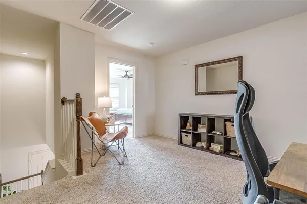 a view of backyard with a garden and entryway