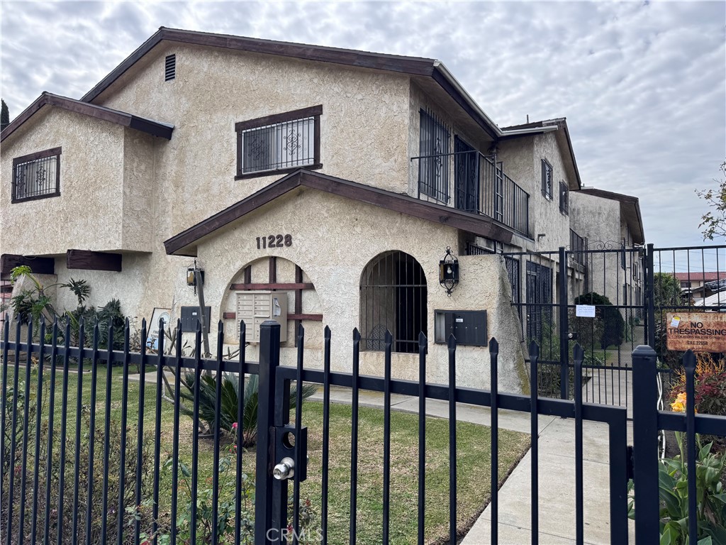 11228 Fineview Street, Unit 4 El Monte, CA 91733 - Photo 1 of 1 a front view of house yard and balcony