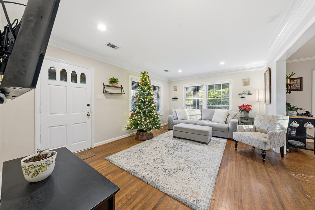 3704 East Britt David Road Columbus, GA 31909 - Photo 11 of 40 a living room with furniture and wooden floor