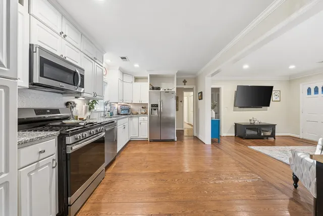 a large kitchen with stainless steel appliances