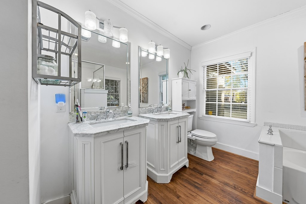 3704 East Britt David Road Columbus, GA 31909 - Photo 23 of 40 a bathroom with a sink a toilet and a mirror