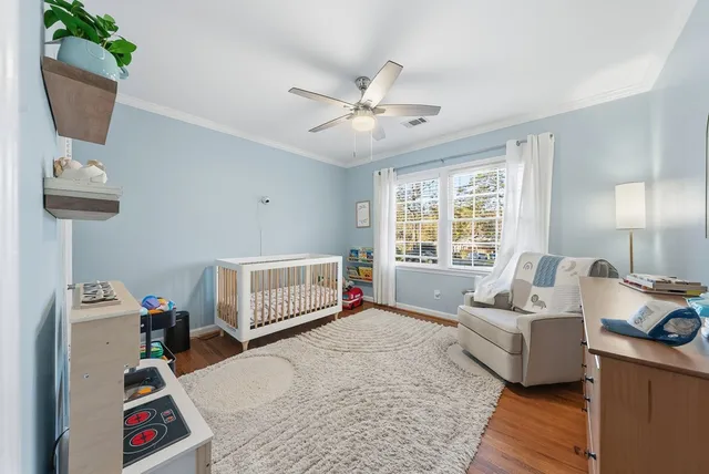 a bedroom with furniture and a window