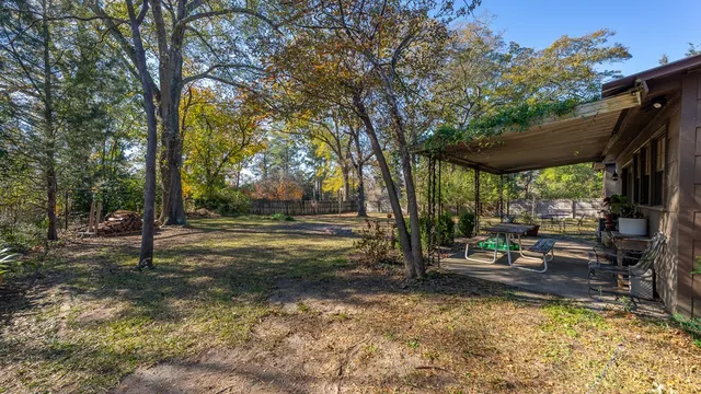 a backyard of a house with lots of green space