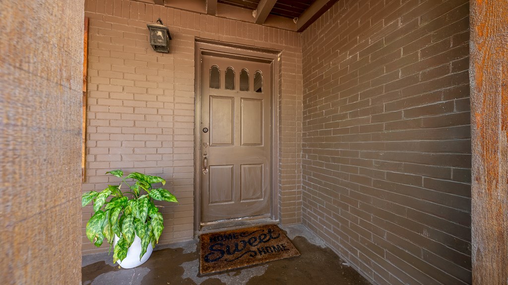 3704 East Britt David Road Columbus, GA 31909 - Photo 9 of 40 a view of a door and chair in the patio